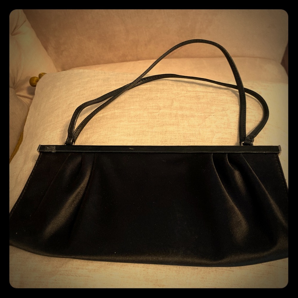Satin clutch with magnetic closure.